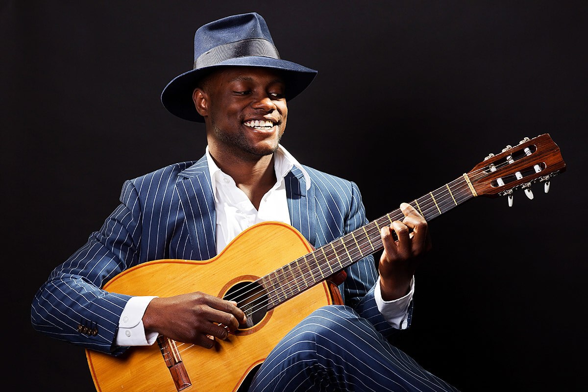 Stylish African American playing guitar and symbolises American culture