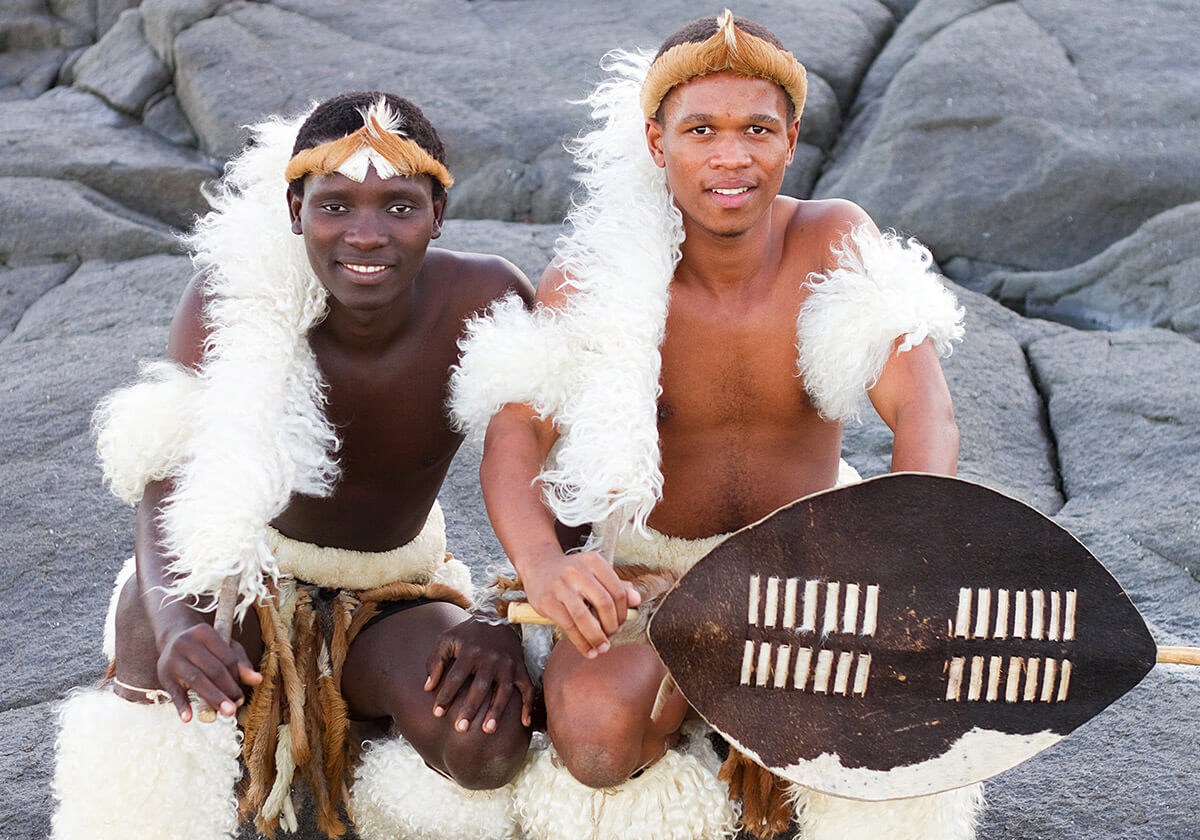 Two African young men with traditional symbols Two African young men with traditional symbols