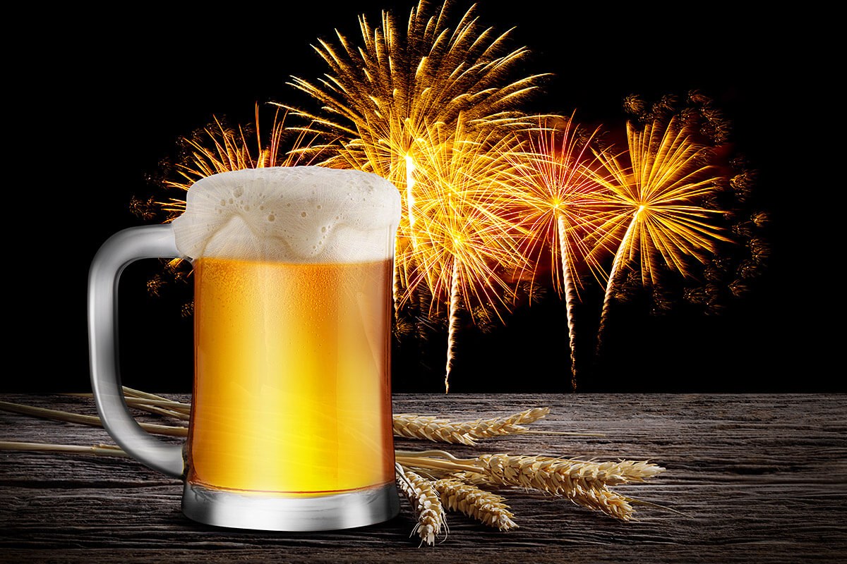 Image of a glass of beer on a background of fireworks Image of a glass of beer on a background of fireworks
