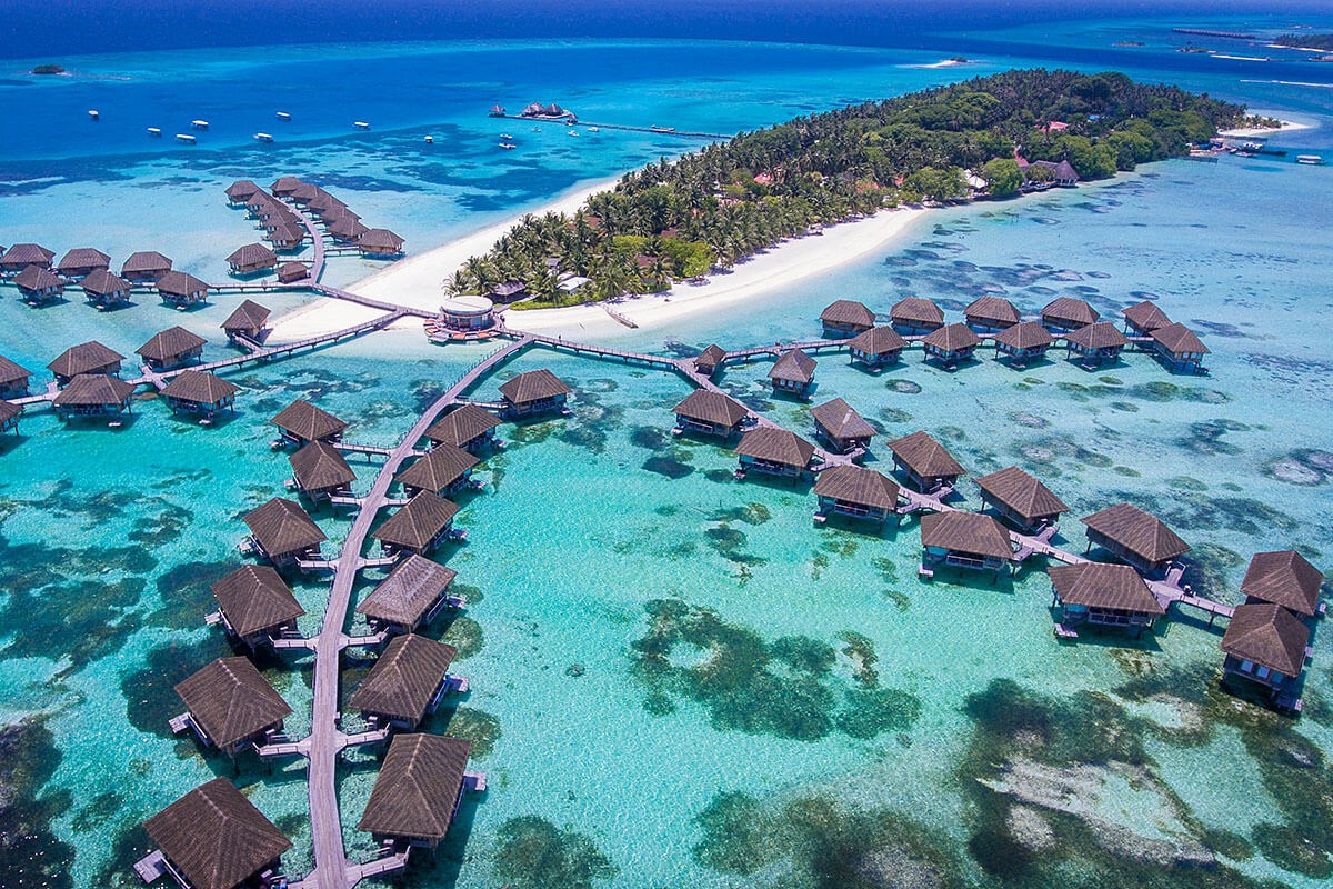 Top view of the island in the Indian Ocean and houses, Maldives Top view of the island in the Indian Ocean and houses, Maldives