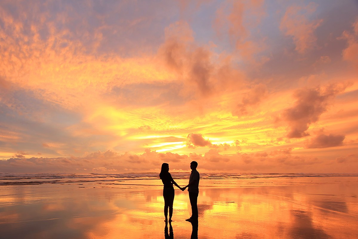Image of two people at sunset Image of two people at sunset