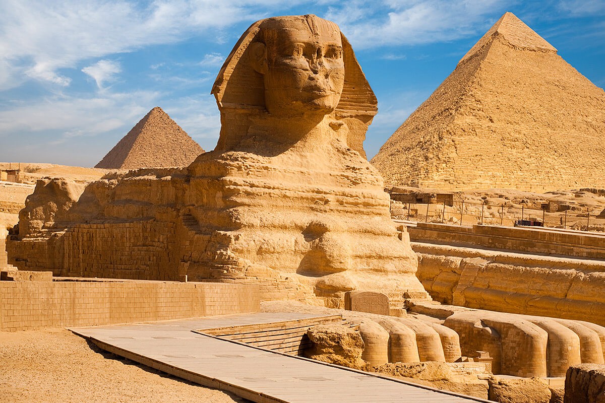 Beautiful profile of the Great Sphinx including pyramids, Giza, Egypt Beautiful profile of the Great Sphinx including pyramids, Giza, Egypt