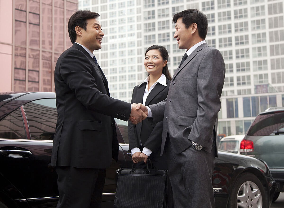 Wealthy Asian businessmen shake hands Wealthy Asian businessmen shake hands