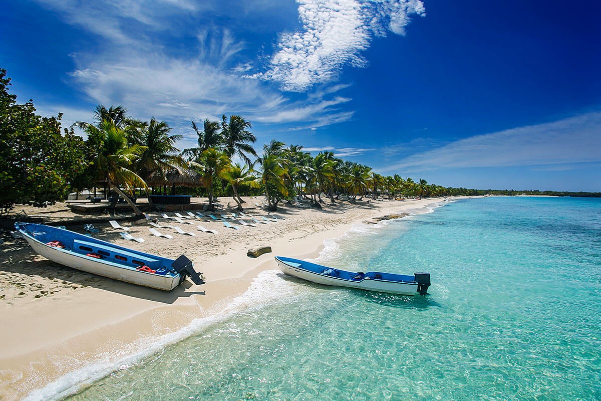 Image of fishing boats and palm trees in Boca Chica, Dominican Republic Image of fishing boats and palm trees in Boca Chica, Dominican Republic