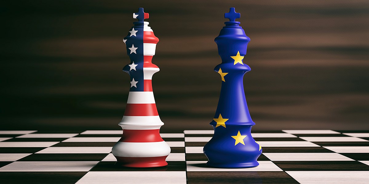 Chessboard with figures painted in the colors of the flags of America and Europe