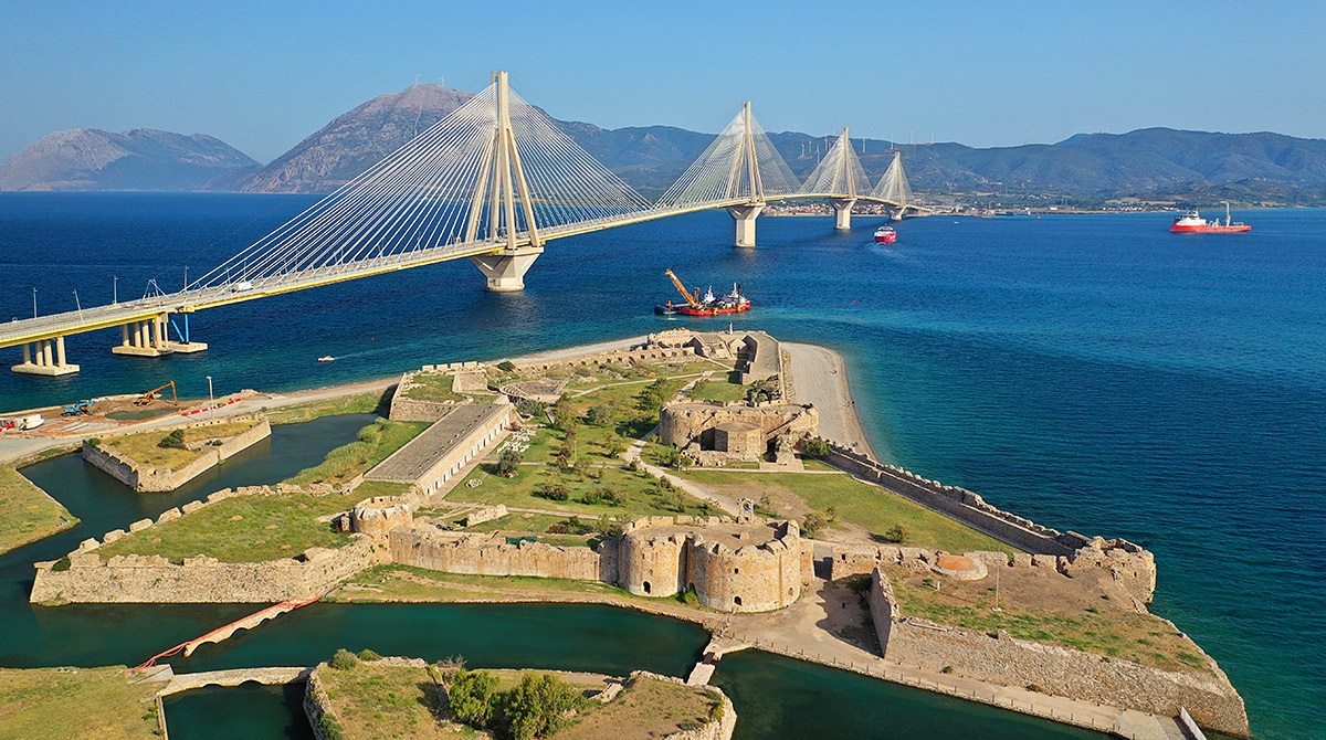 Aerial view to the medieval Rio Castle and the popular Charilaos Trikoupis Bridge, Patras, Greece Aerial view to the medieval Rio Castle and the popular Charilaos Trikoupis Bridge, Patras, Greece