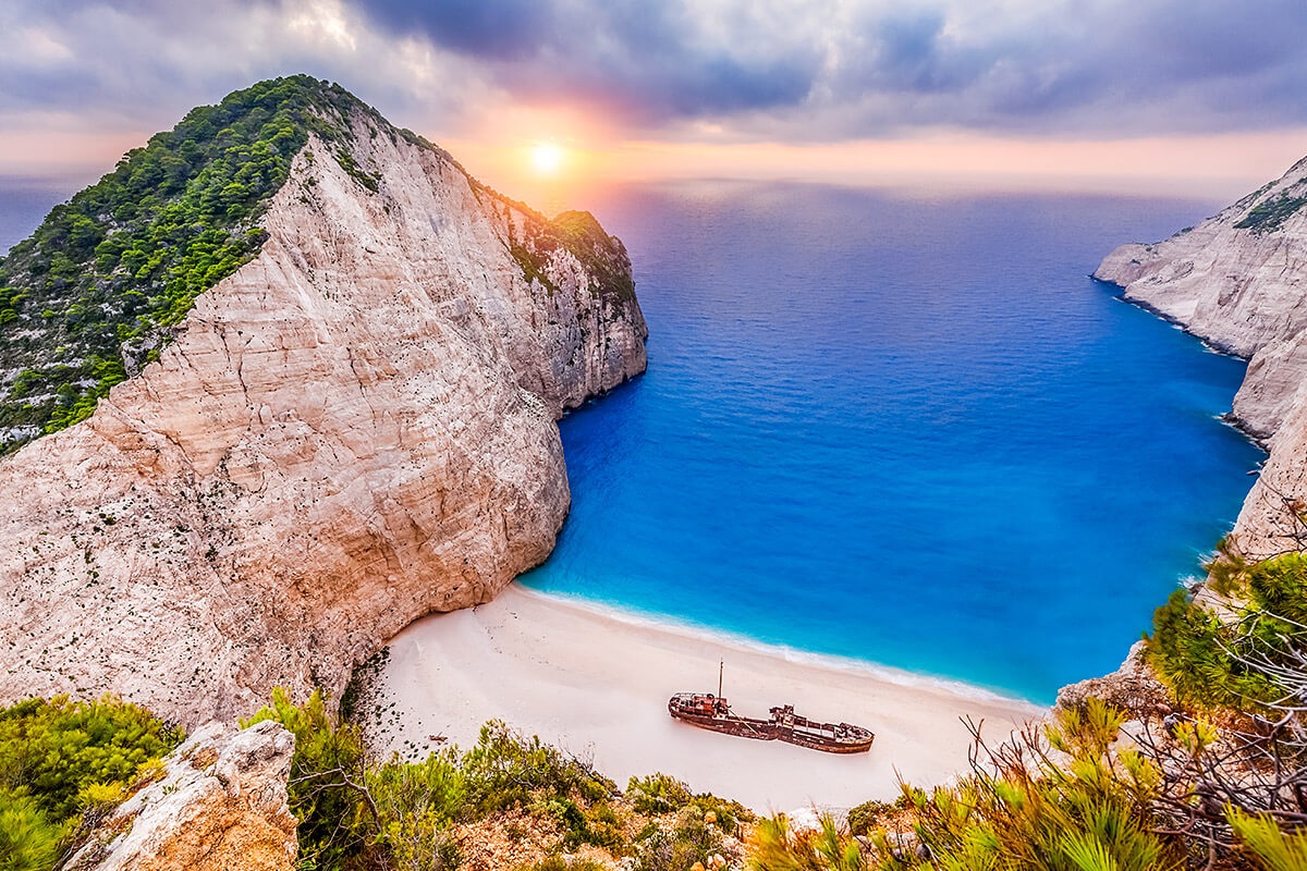 Image of Navagio Beach at sunset, island of Zakynthos Image of Navagio Beach at sunset, island of Zakynthos
