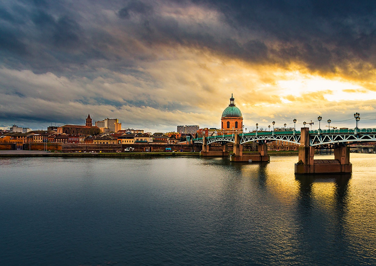 Stunning evening view of the Garonne River and city infrastructure, Toulouse, France Stunning evening view of the Garonne River and city infrastructure, Toulouse, France