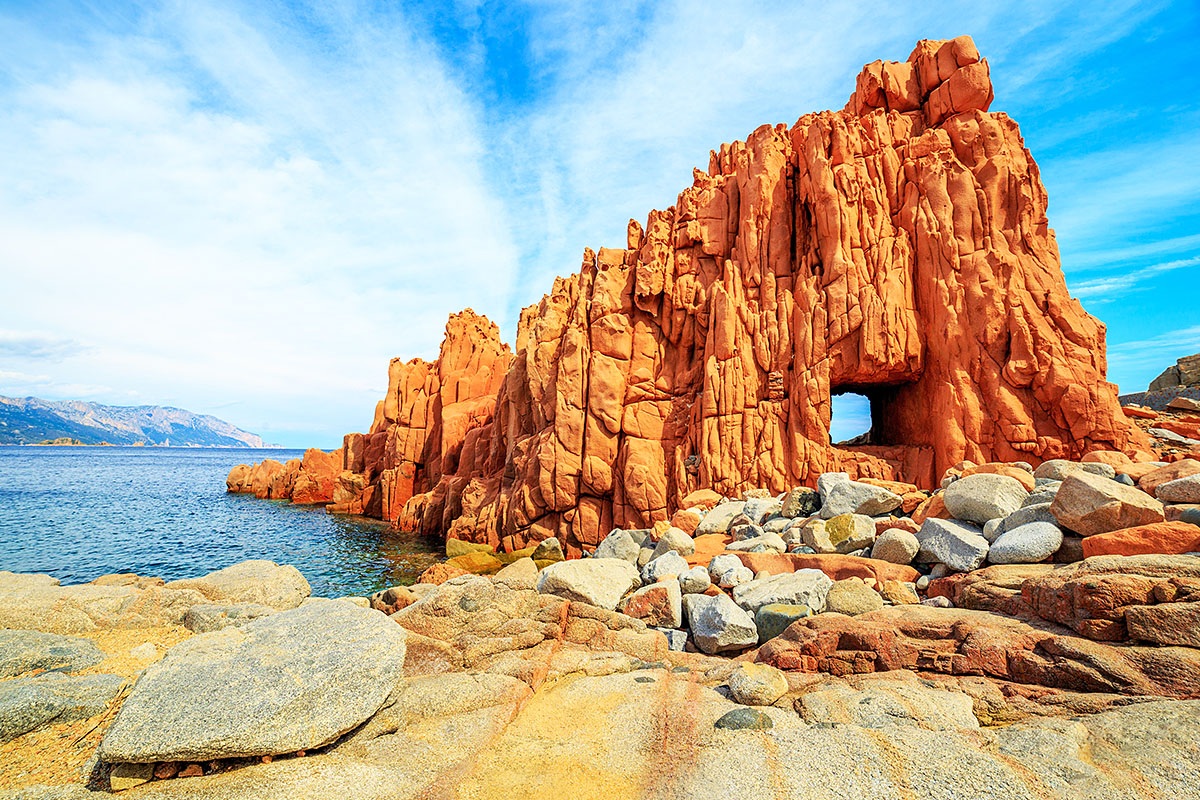 Image of a popular place on the island of Sardinia is Red Rock Image of a popular place on the island of Sardinia is Red Rock