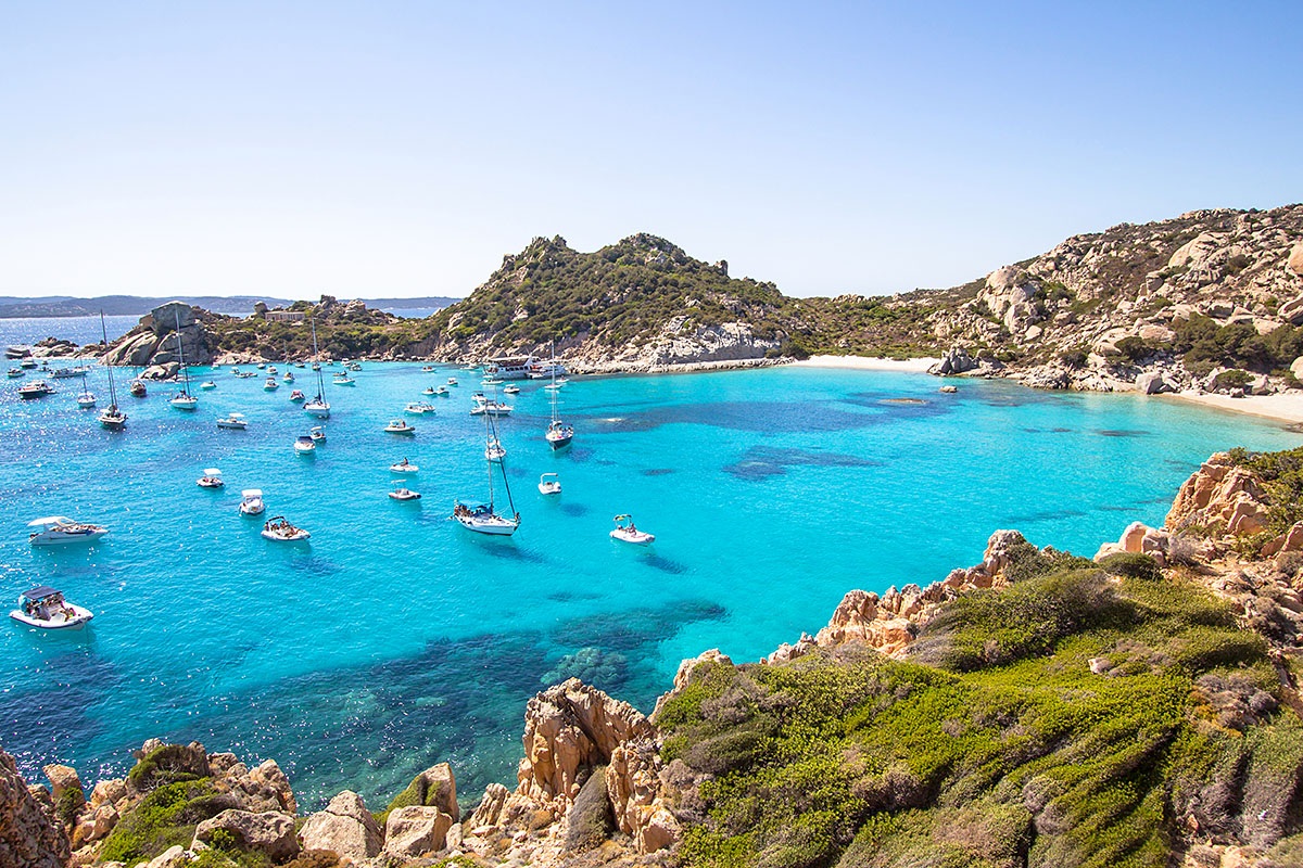 Image of the sea with yachts on a bright and sunny day, Sardinia, Italy Image of the sea with yachts on a bright and sunny day, Sardinia, Italy