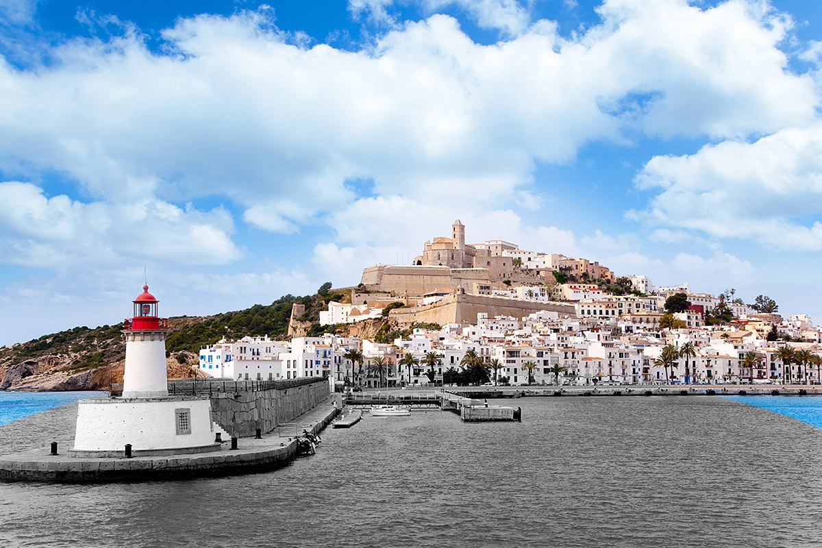 Image of the red lighthouse and buildings, Ibiza