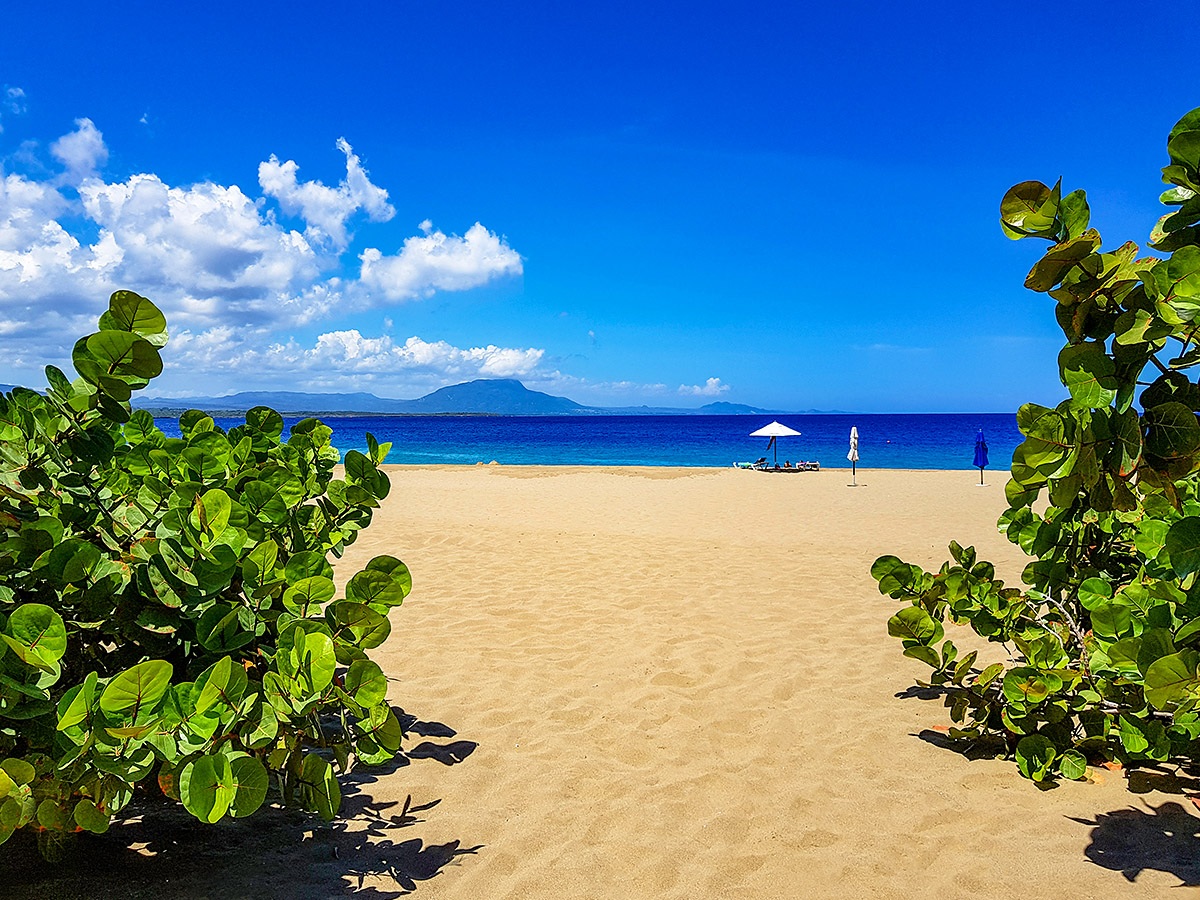 View of the beach and blue sky in the town of Sosua, Dominican Republic View of the beach and blue sky in the town of Sosua, Dominican Republic