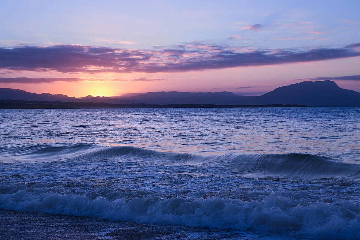 View of the ocean and mountains during sunset, Sosua, Dominican Republic View of the ocean and mountains during sunset, Sosua, Dominican Republic