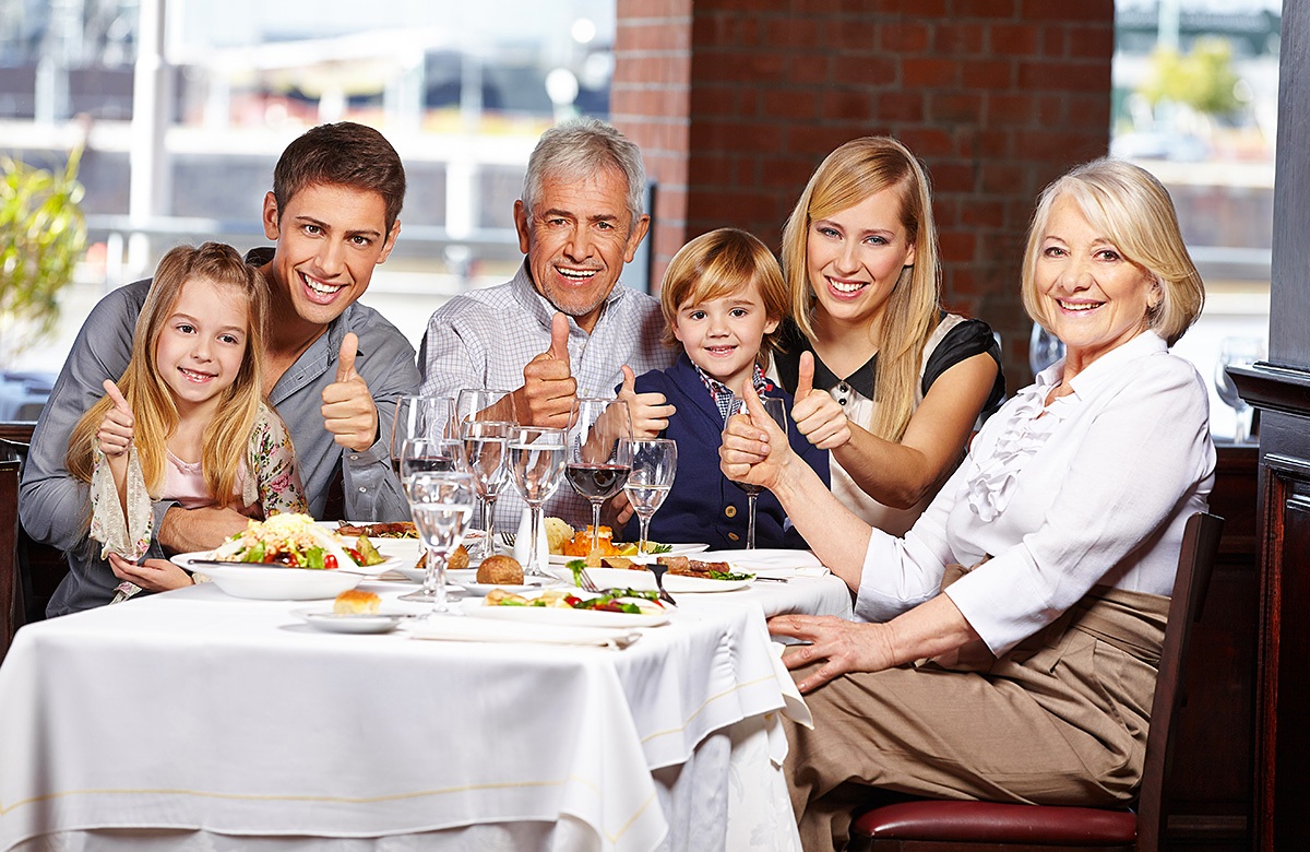 Happy big family at the dinner table
