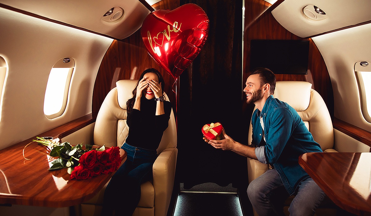 Man gives his beloved woman a gift on board the plane