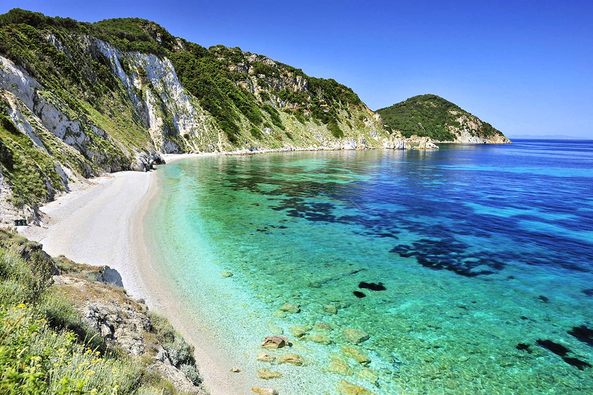 Beautiful view of the beach at the foot of the mountains on the island of Elba in Italy Beautiful view of the beach at the foot of the mountains on the island of Elba in Italy