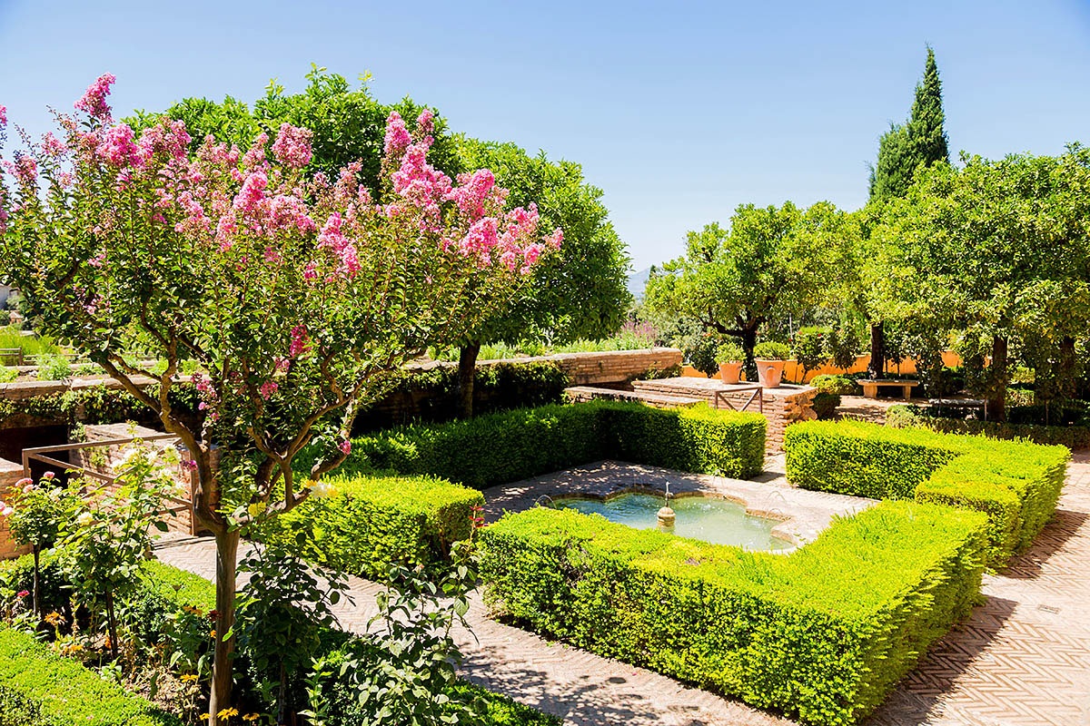 Image of the Generalife courtyard with historic fountain and garden, Granada city
