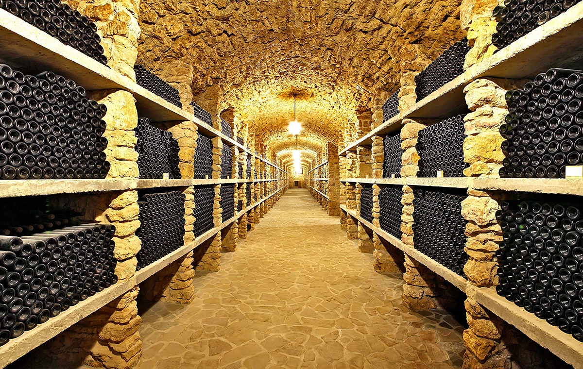 Image of many bottles of wine in an old cellar, city of Bordeaux Image of many bottles of wine in an old cellar, city of Bordeaux