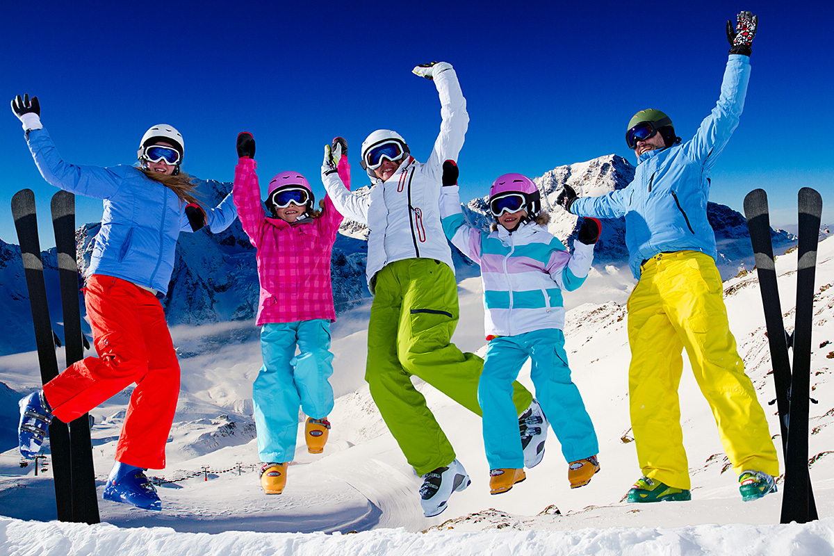 Joyful company of people skiing in the mountains in the snow Joyful company of people skiing in the mountains in the snow