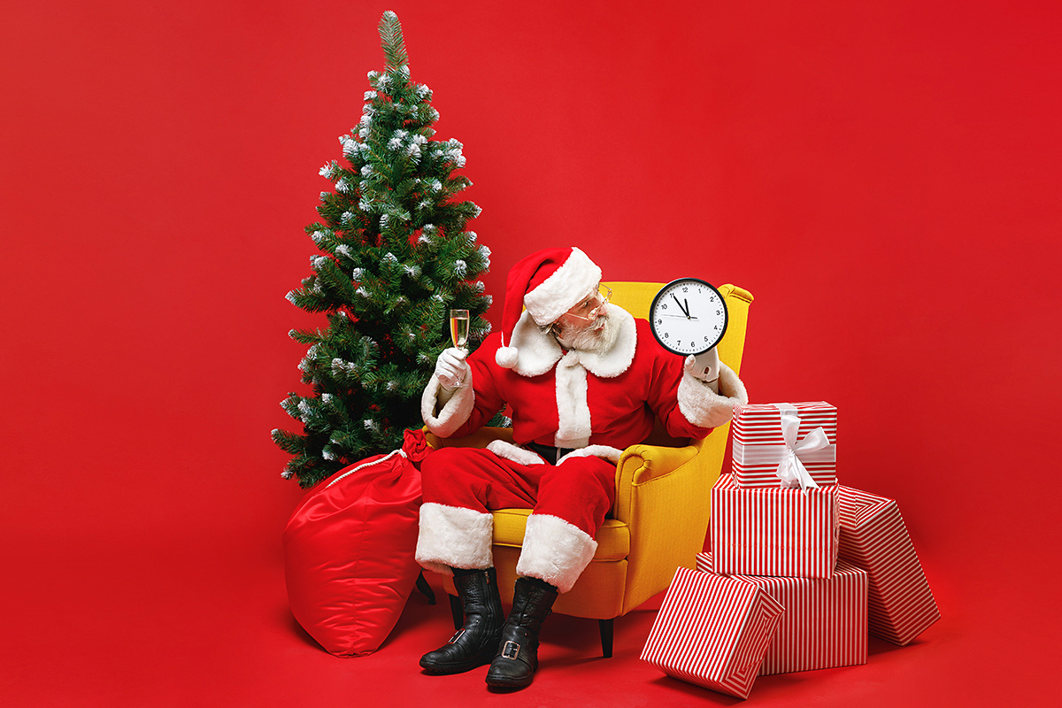 Image of Santa Claus near the Christmas tree Image of Santa Claus near the Christmas tree