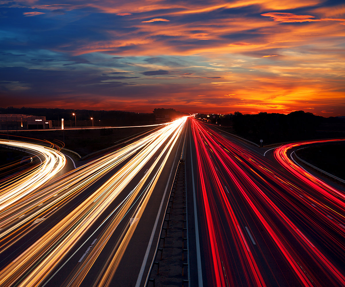 Active car traffic at the moment of sunset Active car traffic at the moment of sunset