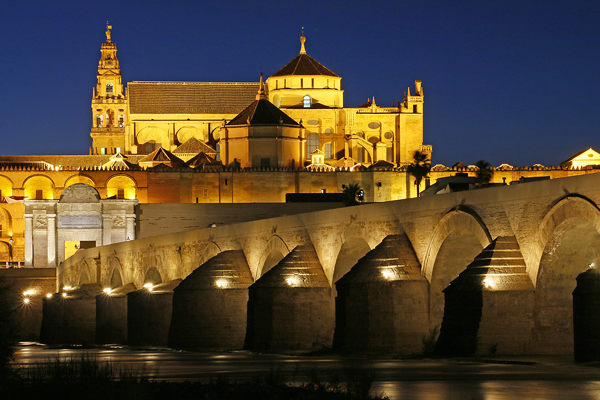 Night view of the old Roman bridge and the Cathedral, Cordoba, Spain Night view of the old Roman bridge and the Cathedral, Cordoba, Spain