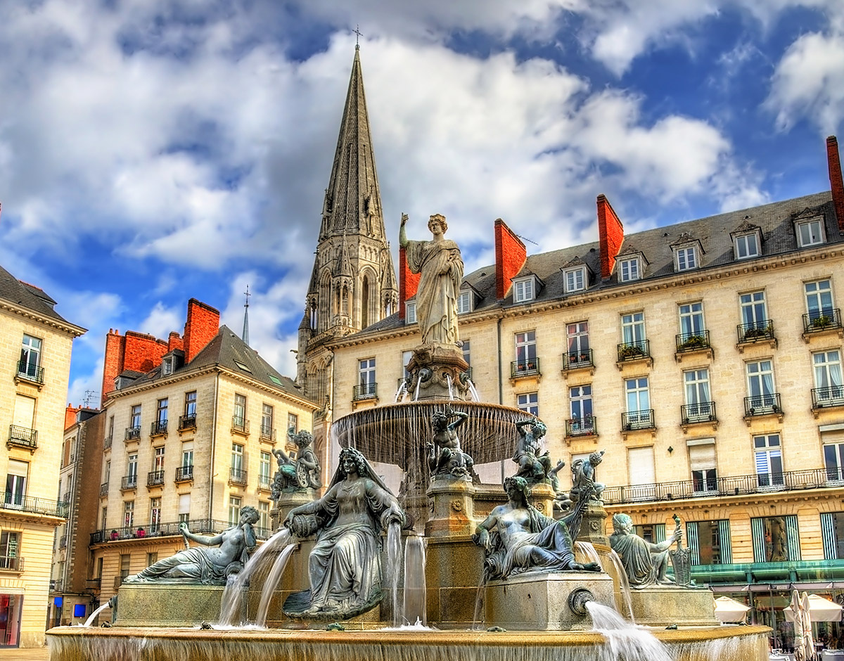 Stunning view of the fountain and Cathedral in the city of Nantes, France Stunning view of the fountain and Cathedral in the city of Nantes, France