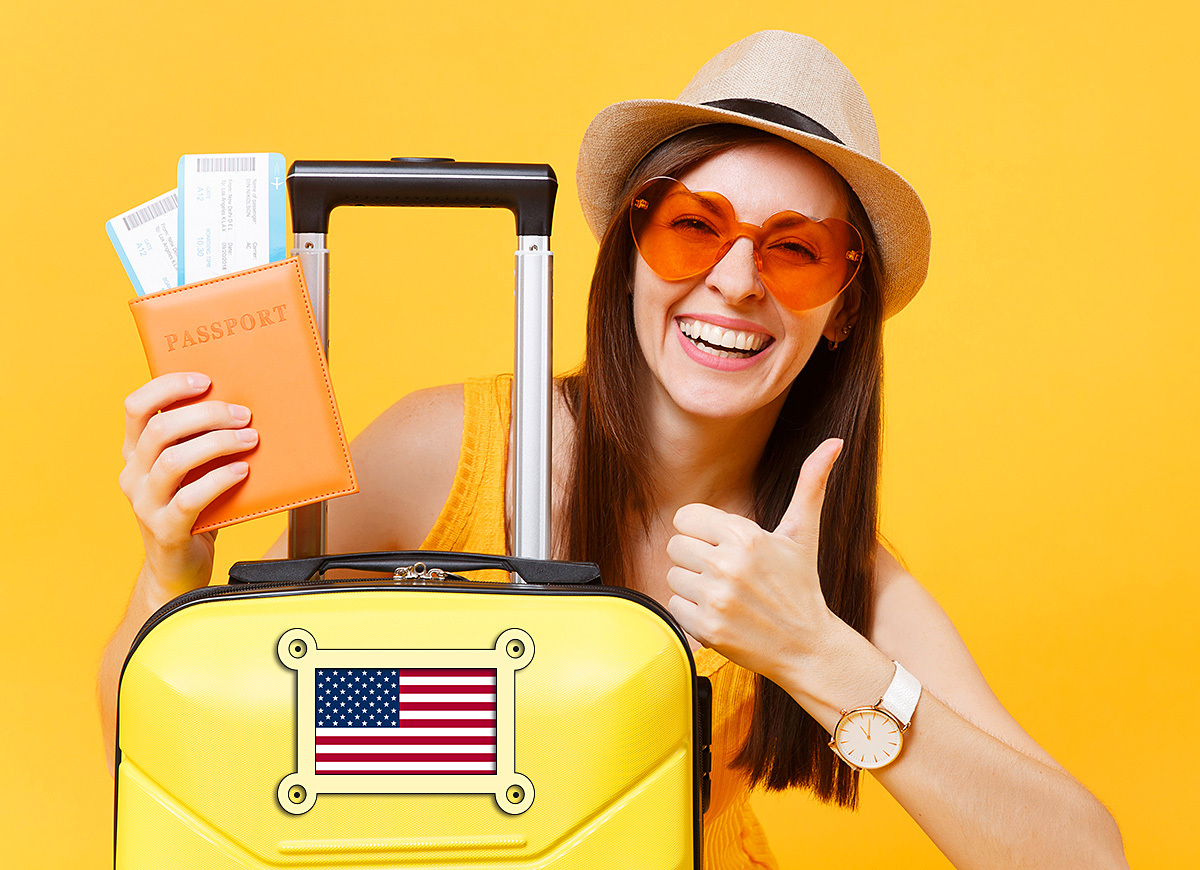 Cute girl with a passport and tickets to America in her hands