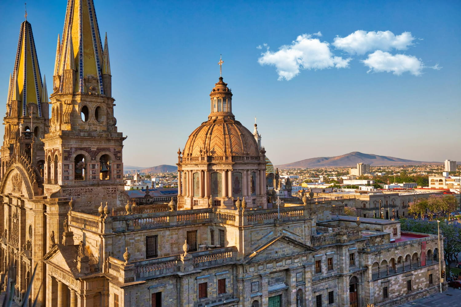 The building is constructed from light-colored stone with intricate architectural detailing throughout. The building is constructed from light-colored stone with intricate architectural detailing throughout.