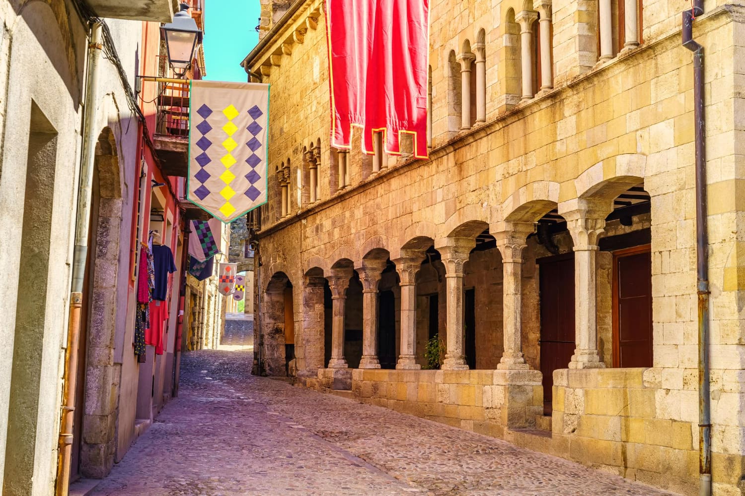 This captivating photograph beautifully captures the dynamic contrast between ancient heritage and contemporary vibrancy in a historic European town.