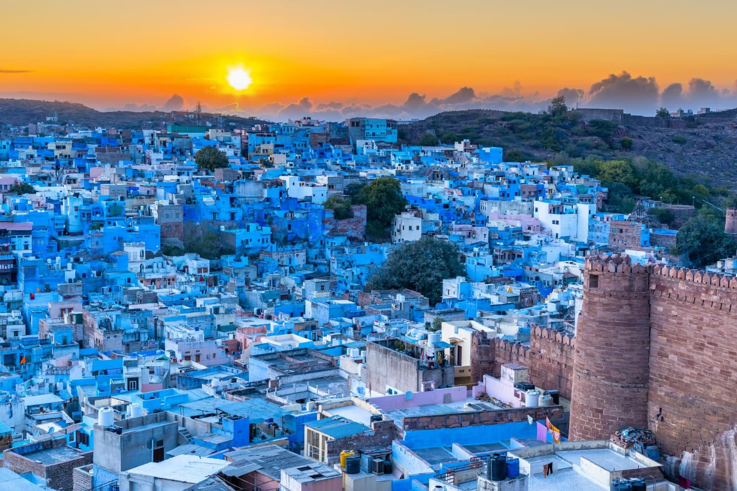 This breathtaking panoramic photograph captures the full majesty of Chefchaouen at the golden hour.