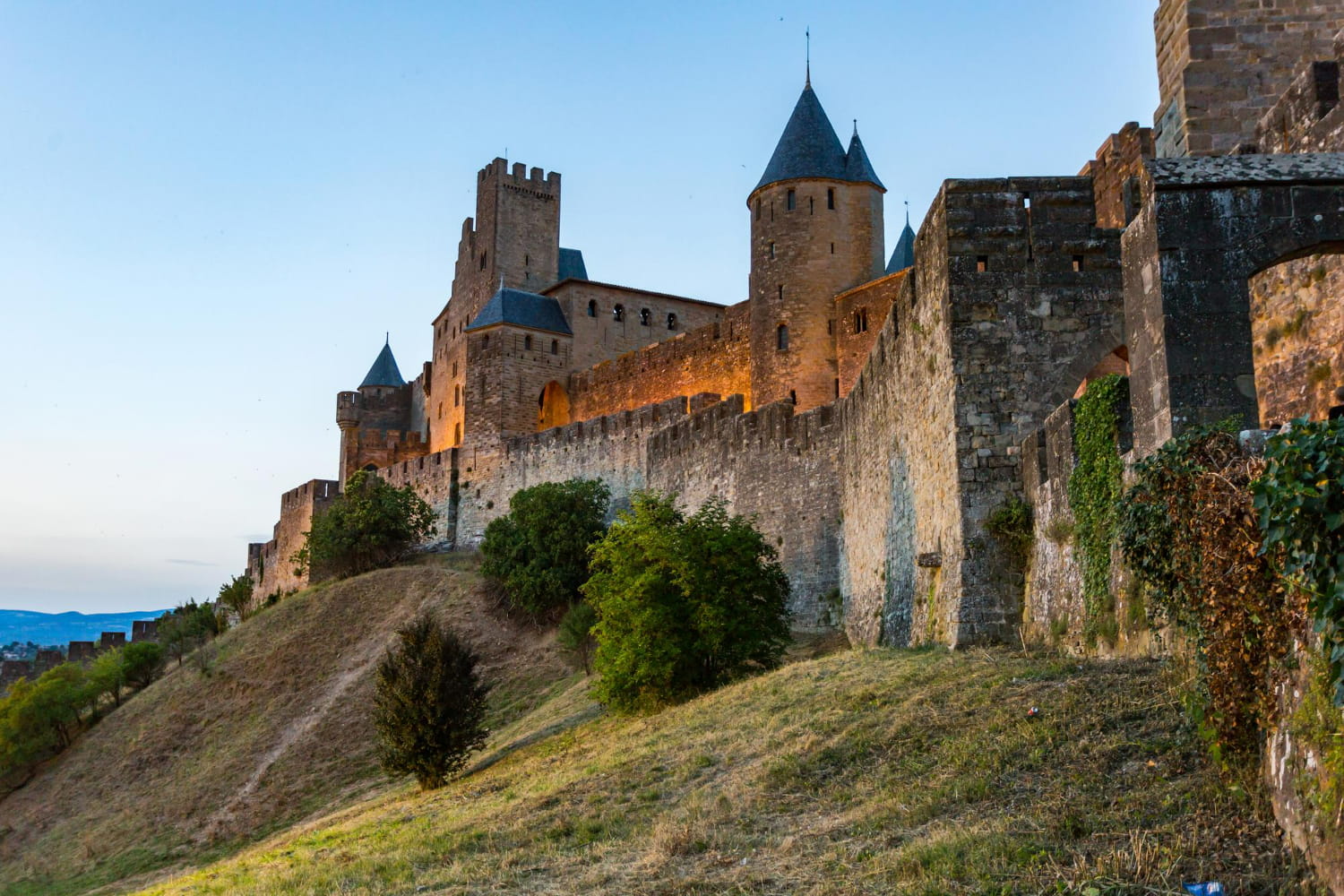The composition showcases the castle perched majestically on a hillside, its formidable presence commanding the landscape.