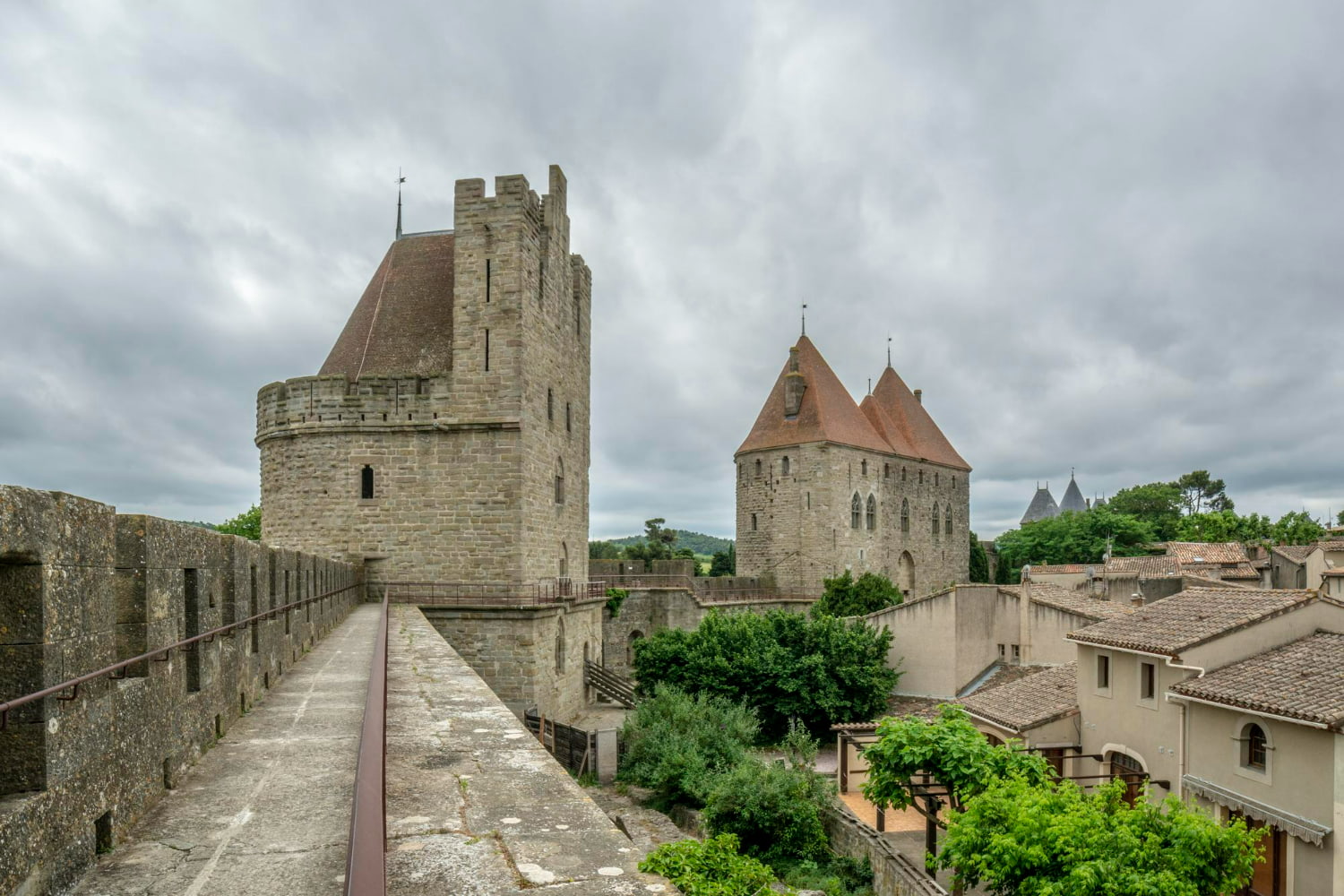 This compelling photograph documents a beautifully preserved medieval fortress from an elevated vantage point along its historic defensive ramparts.